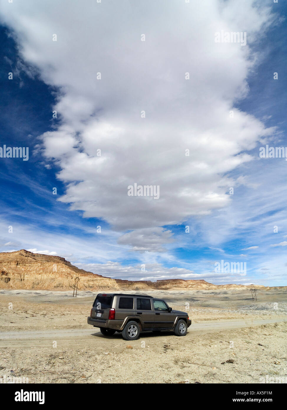 Jeep Comander 4x4 driving through the badlands at Grand Staircase