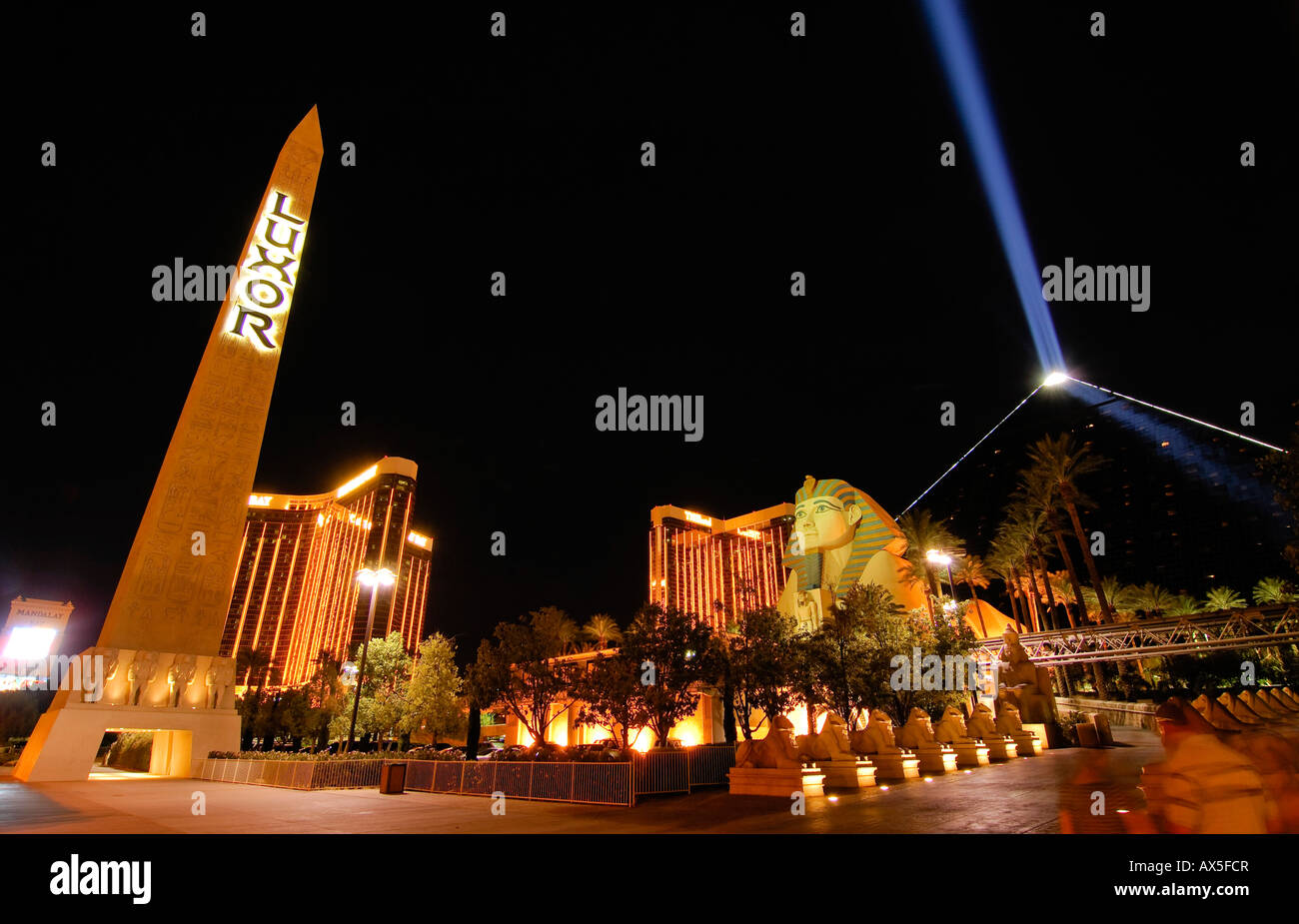 Exterior, night, sphinx replica and the 'space beam, ' main entrance to the Luxor Hotel & Casino, Las Vegas Boulevard, Las Vega Stock Photo