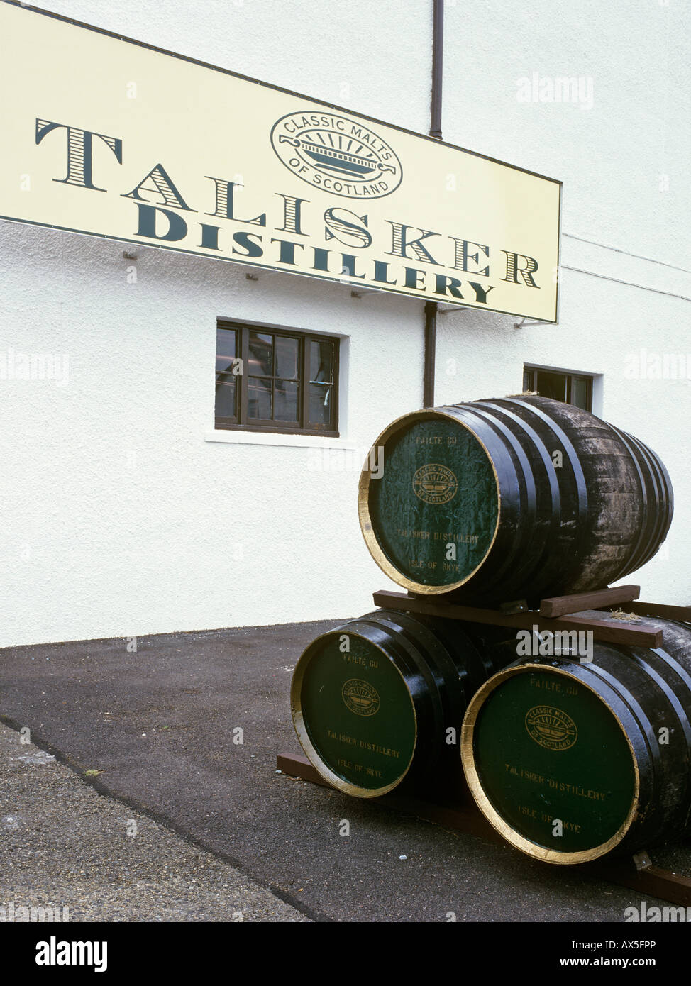 Barrels and company sign of the Talisker Distillery, Isle of Skye, Scotland, UK, Europe Stock Photo