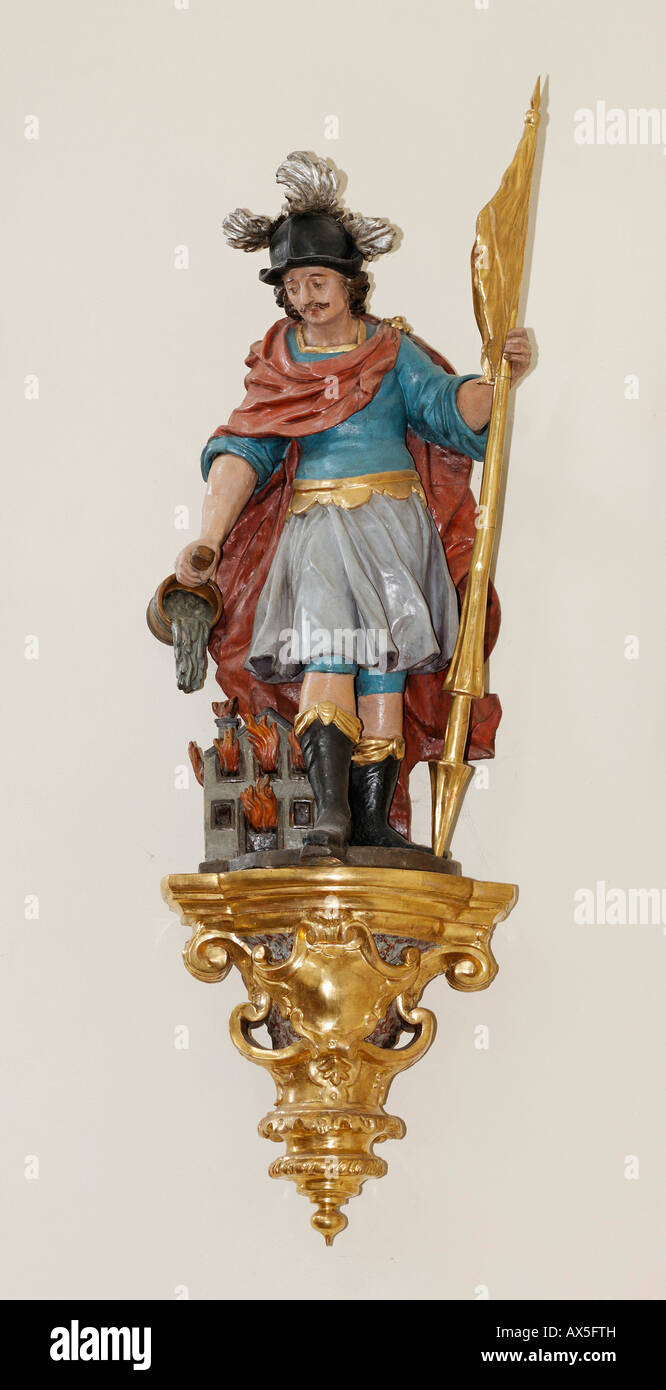 Statue of St. Florian (Florian of Lorch) at the parish church in Schoengau, Triestingtal, Lower Austria, Austria Stock Photo
