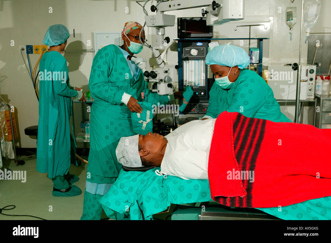 Physicians and patient in the operating room after cataract surgery, Pietermaritzburg, South Africa, Africa Stock Photo