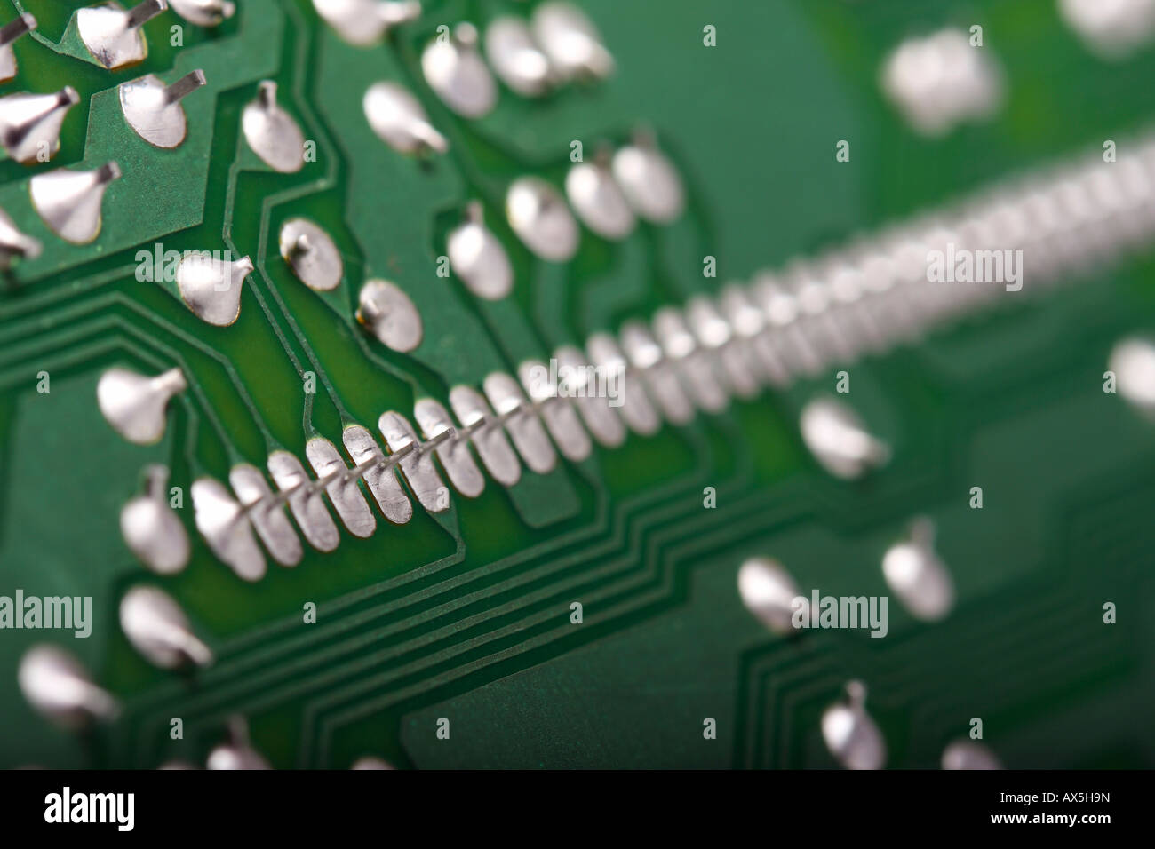 Green printed wiring board with soldering points Stock Photo