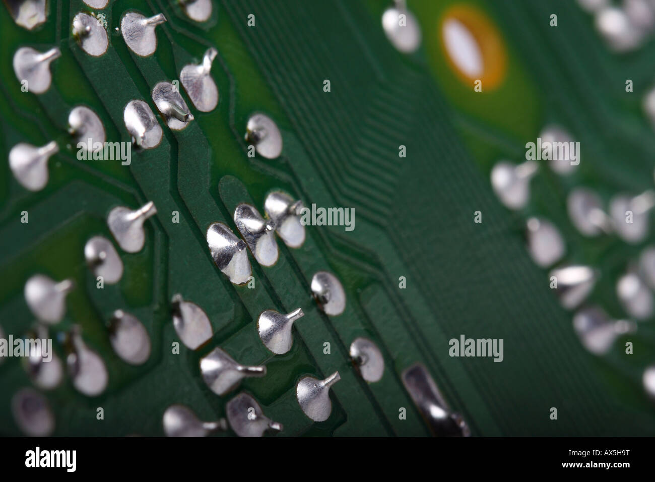 Green printed wiring board with soldering points Stock Photo