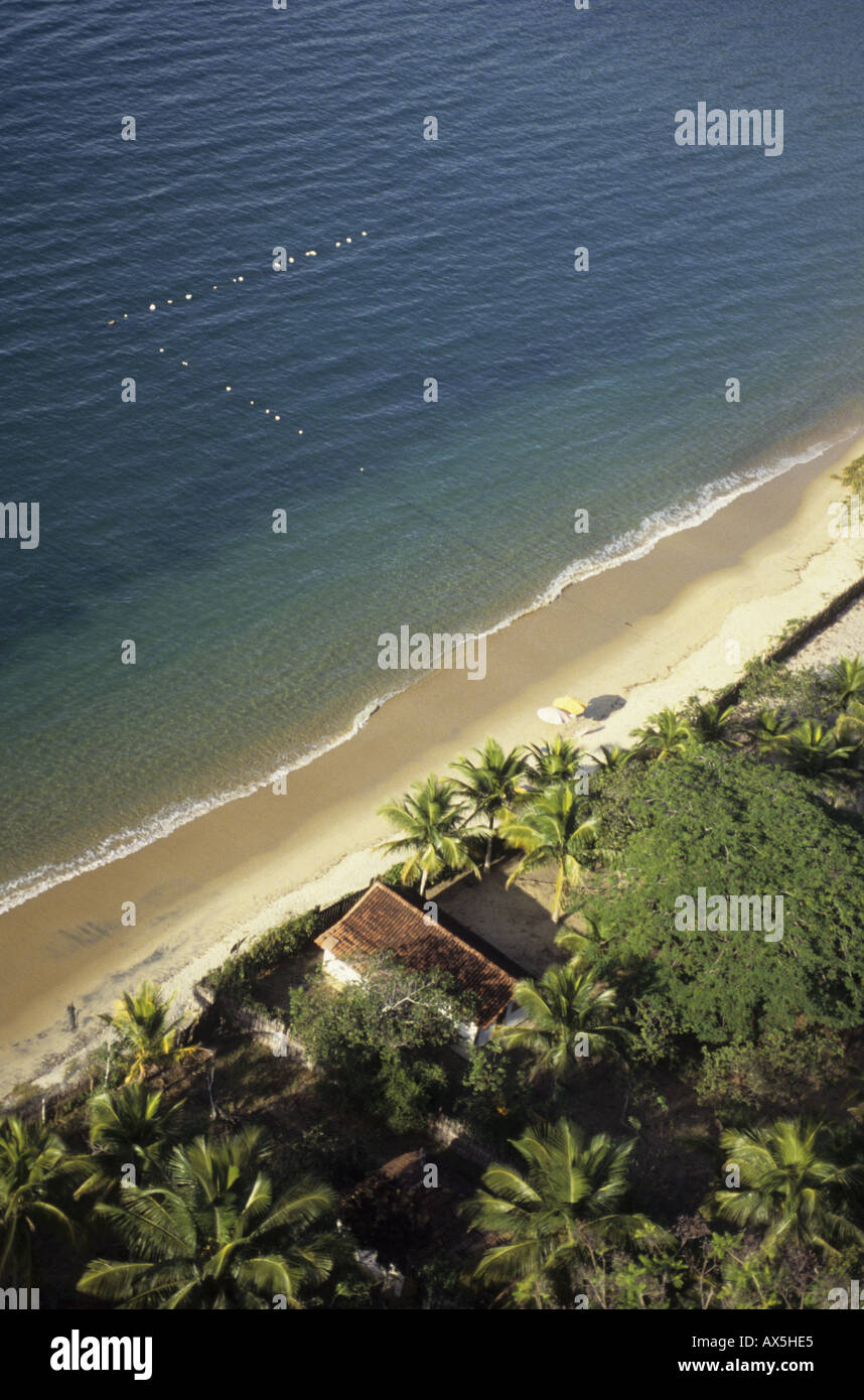 Ilha Grande, Brazil. Aerial view of house on the sandy beach surrounded