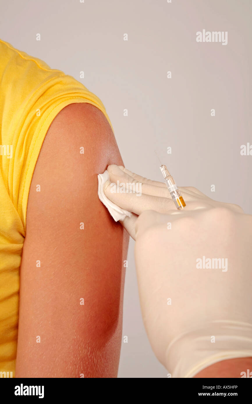 Vaccination into the upper arm Stock Photo