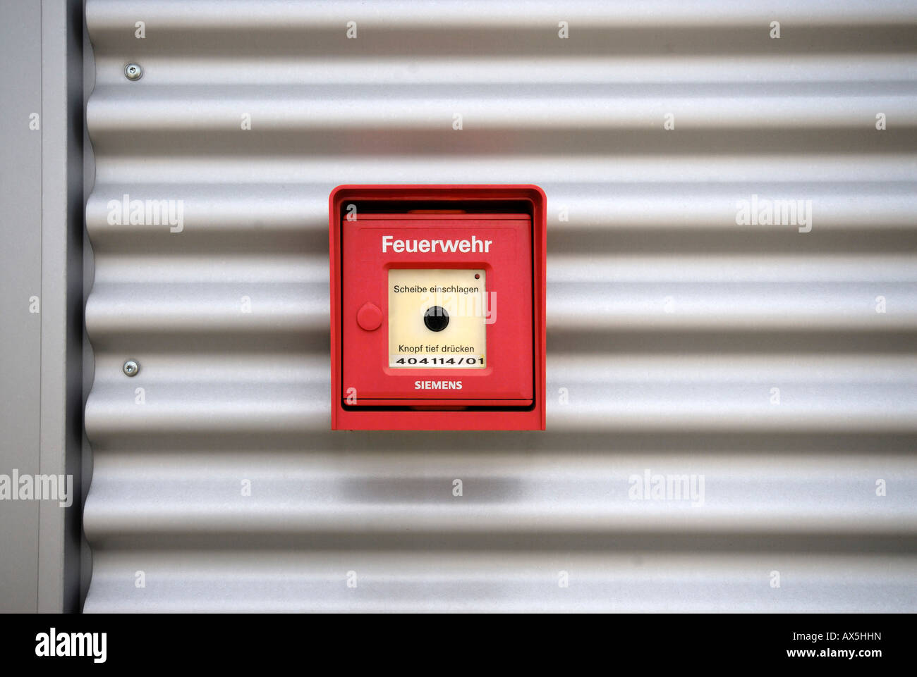 Fire alarm box on an aluminium facade Stock Photo