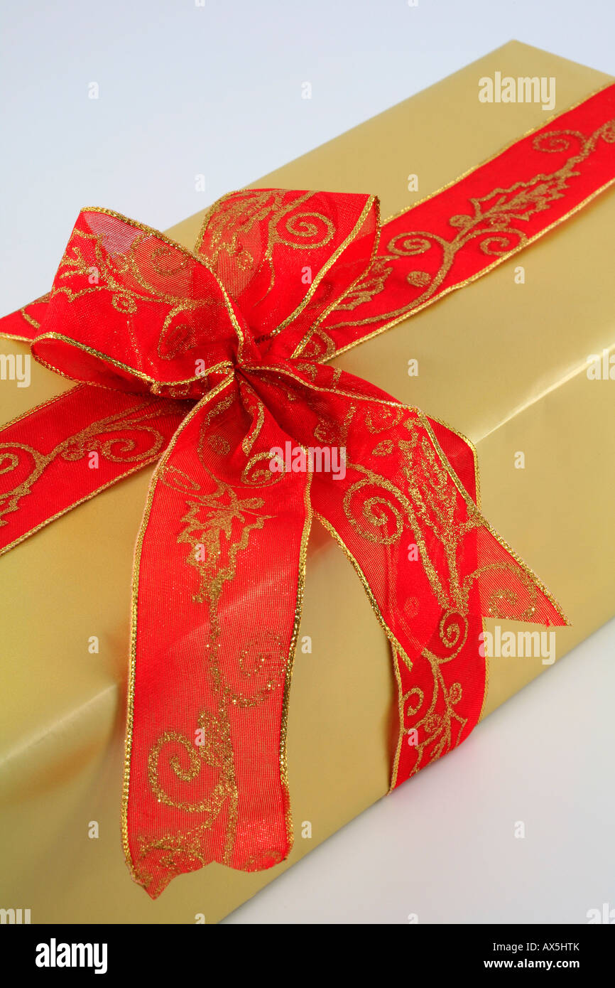 Wrapped christmas present with large red bow Stock Photo