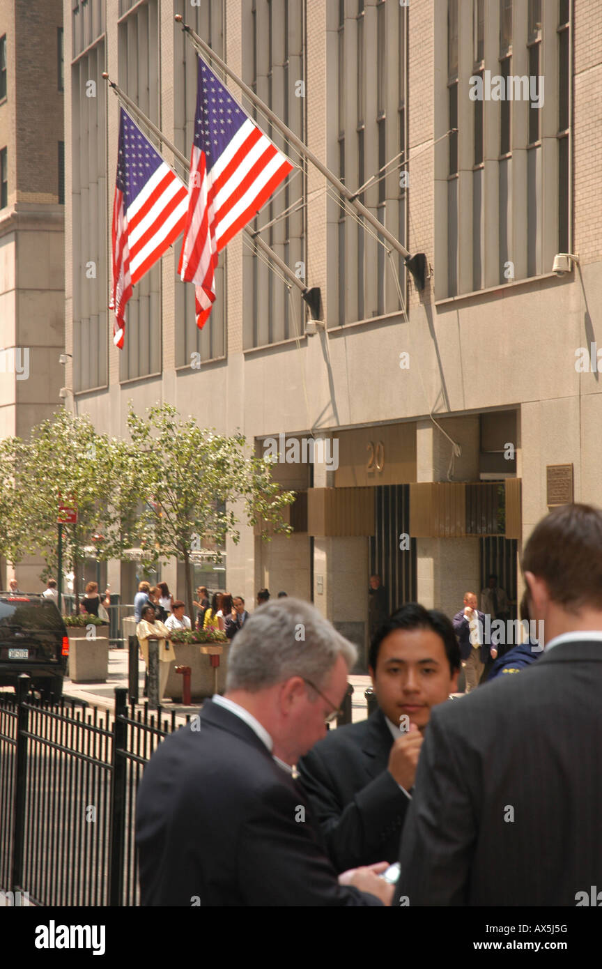 Businessmen in front of Wall Street New York USA Stock Photo Alamy