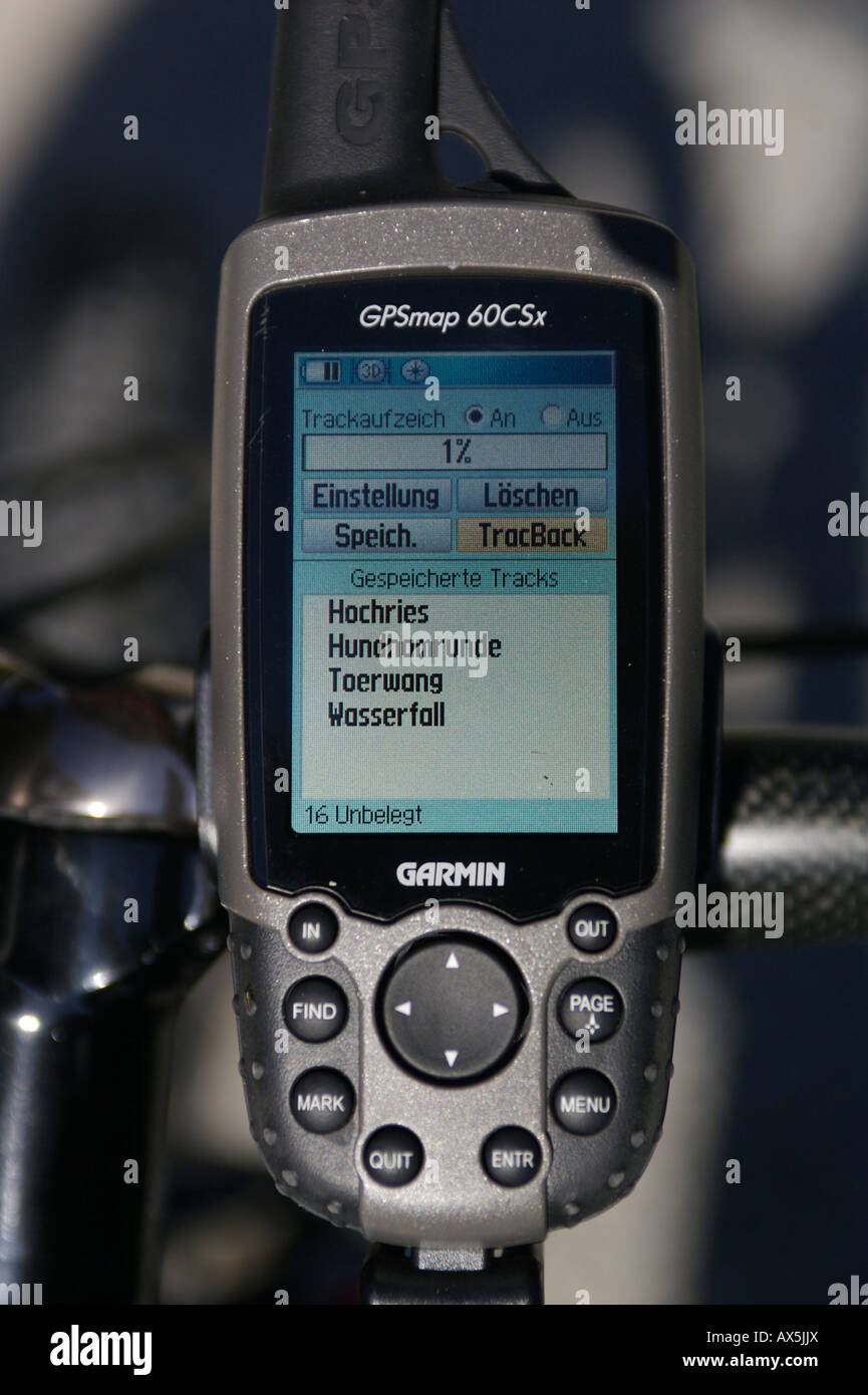 Mobile GPS unit on mountain bike handlebars, monitors showing saved