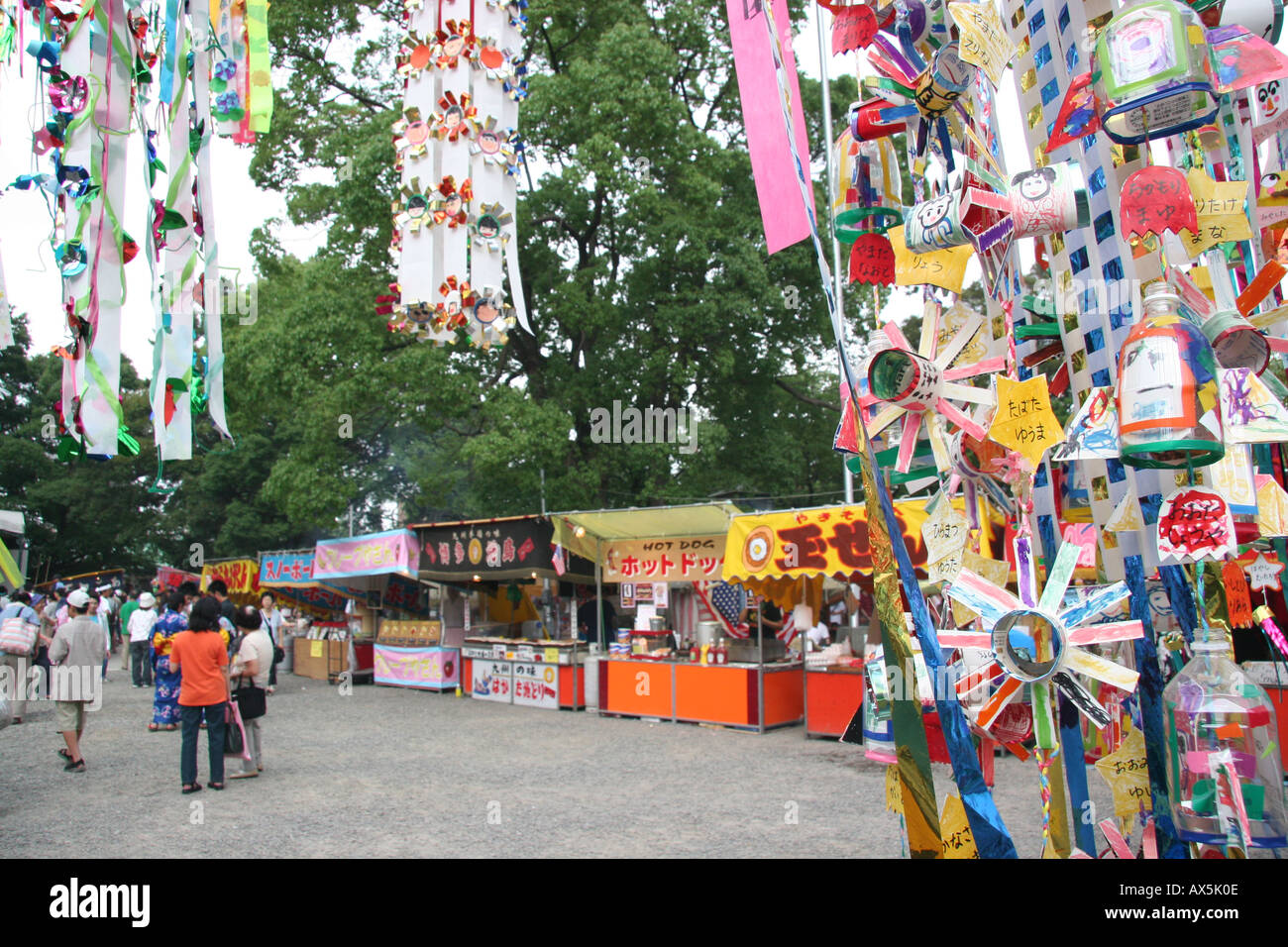 Stalls selling food in the grounds of a shinto shrine during a summer festival in Japan Stock Photo