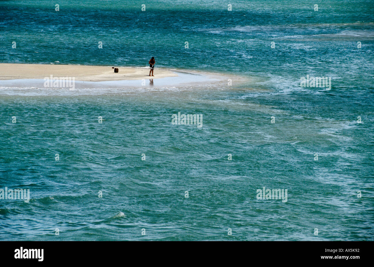 Itaparica Island, Bahia, Brazil. Fisherman on a spit of sand. Stock Photo