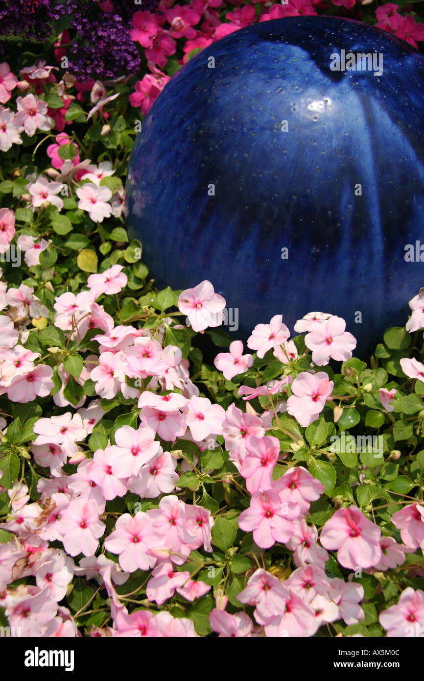 Pink flowers and blue orb Stock Photo