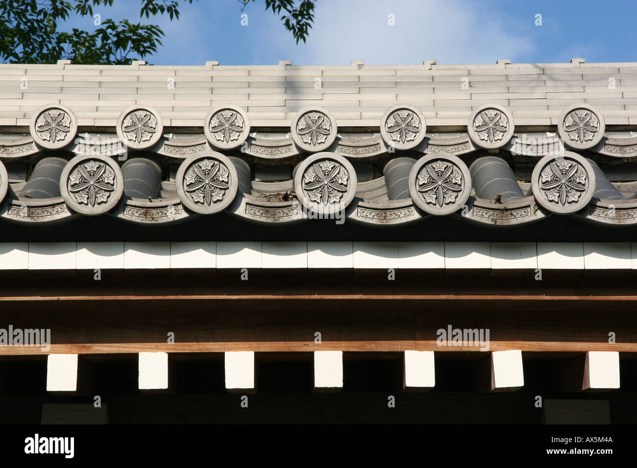Traditional roof with family crest design in Kyoto, Japan Stock Photo
