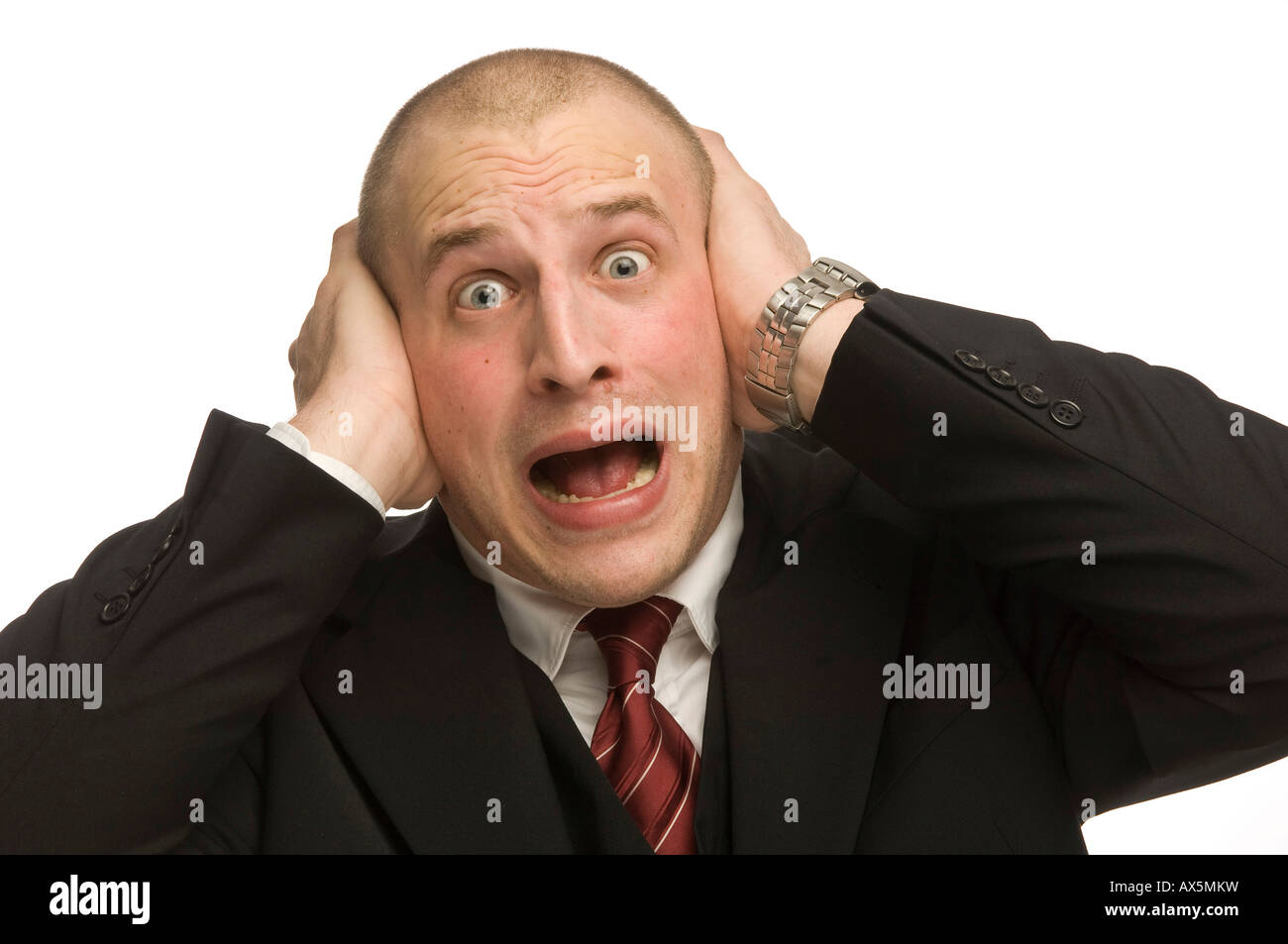 Young man covering his ears Stock Photo