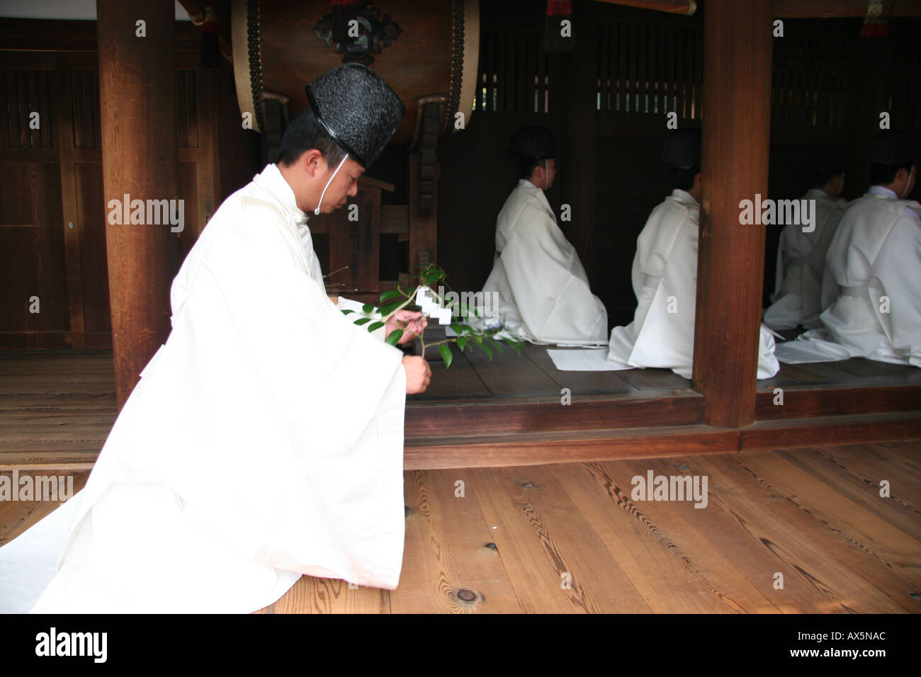 Shinto priest during a harvest festival ceremony at a shrine in Japan Stock Photo