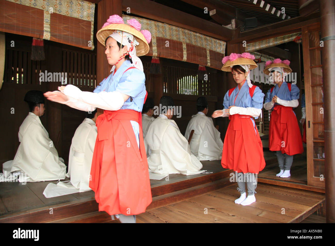 Young women dancing at a harvest festival at a shinto shrine in Japan Stock Photo