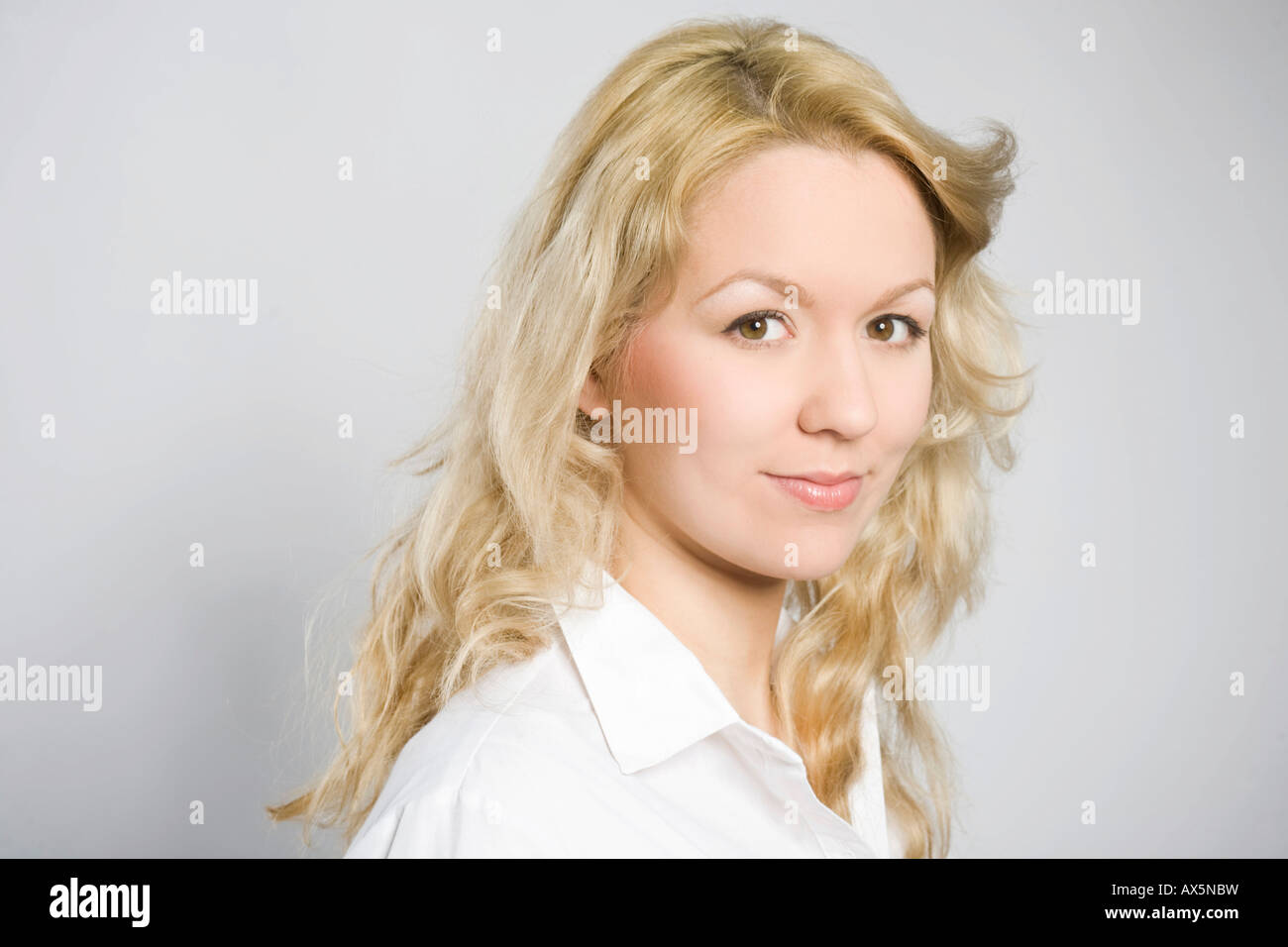 Portrait of a smiling young blonde woman Stock Photo - Alamy