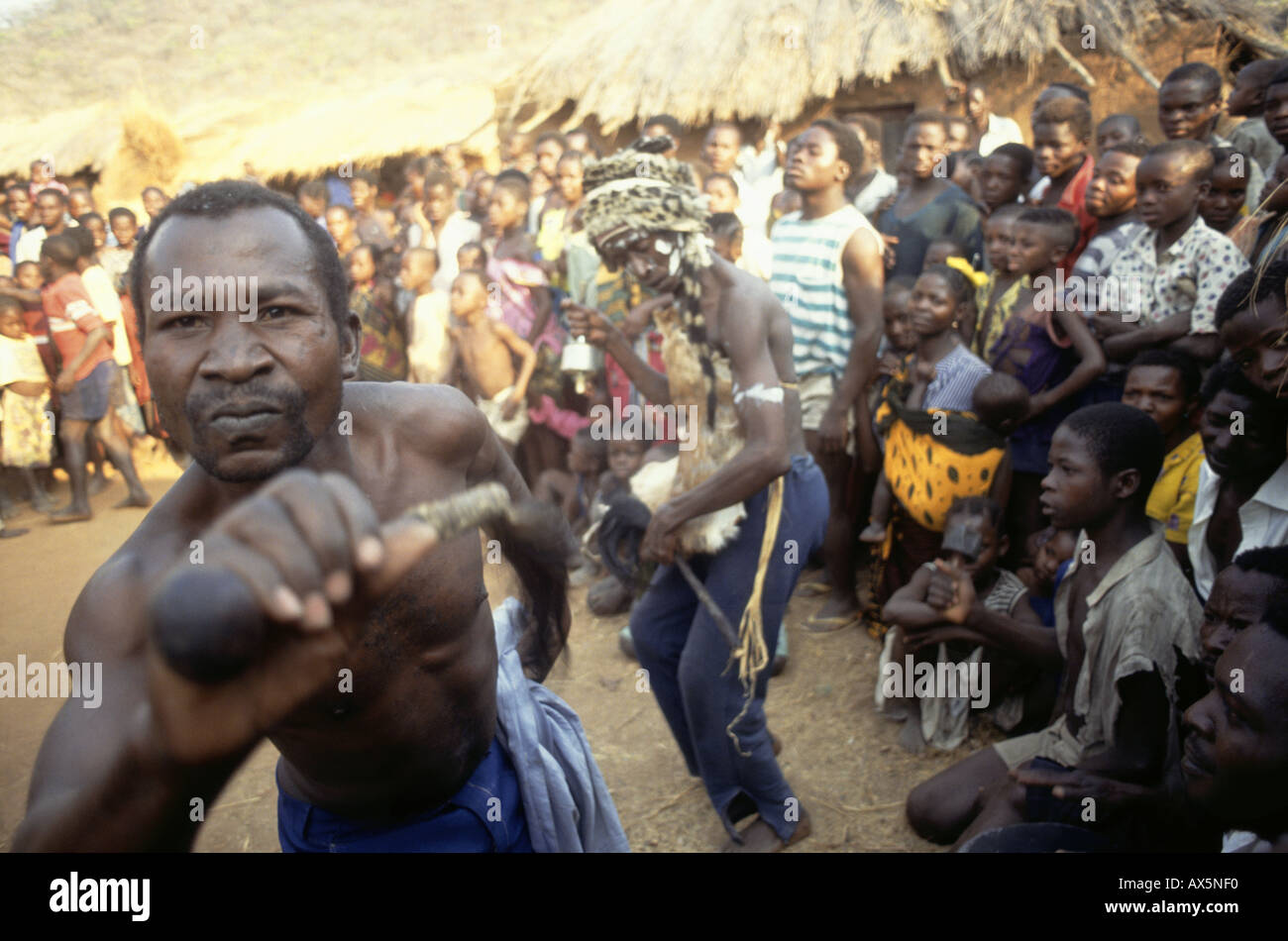 Yumba Bay, Tanzania. Village shamans (witch doctors) dancing a ritual in front of the whole village. Stock Photo