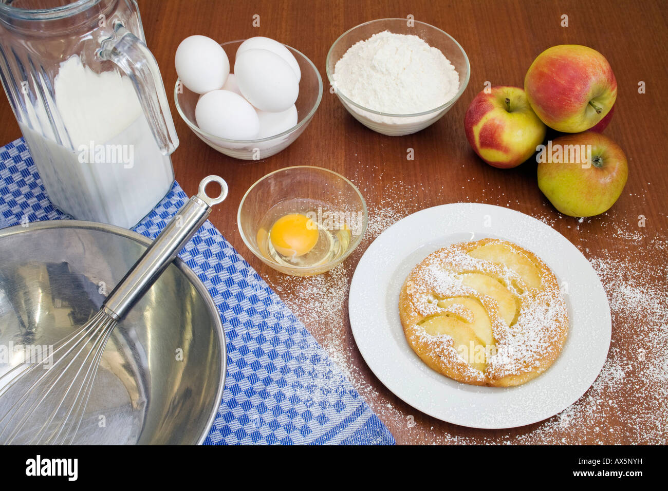 Apple pancakes surrounded by ingredients Stock Photo