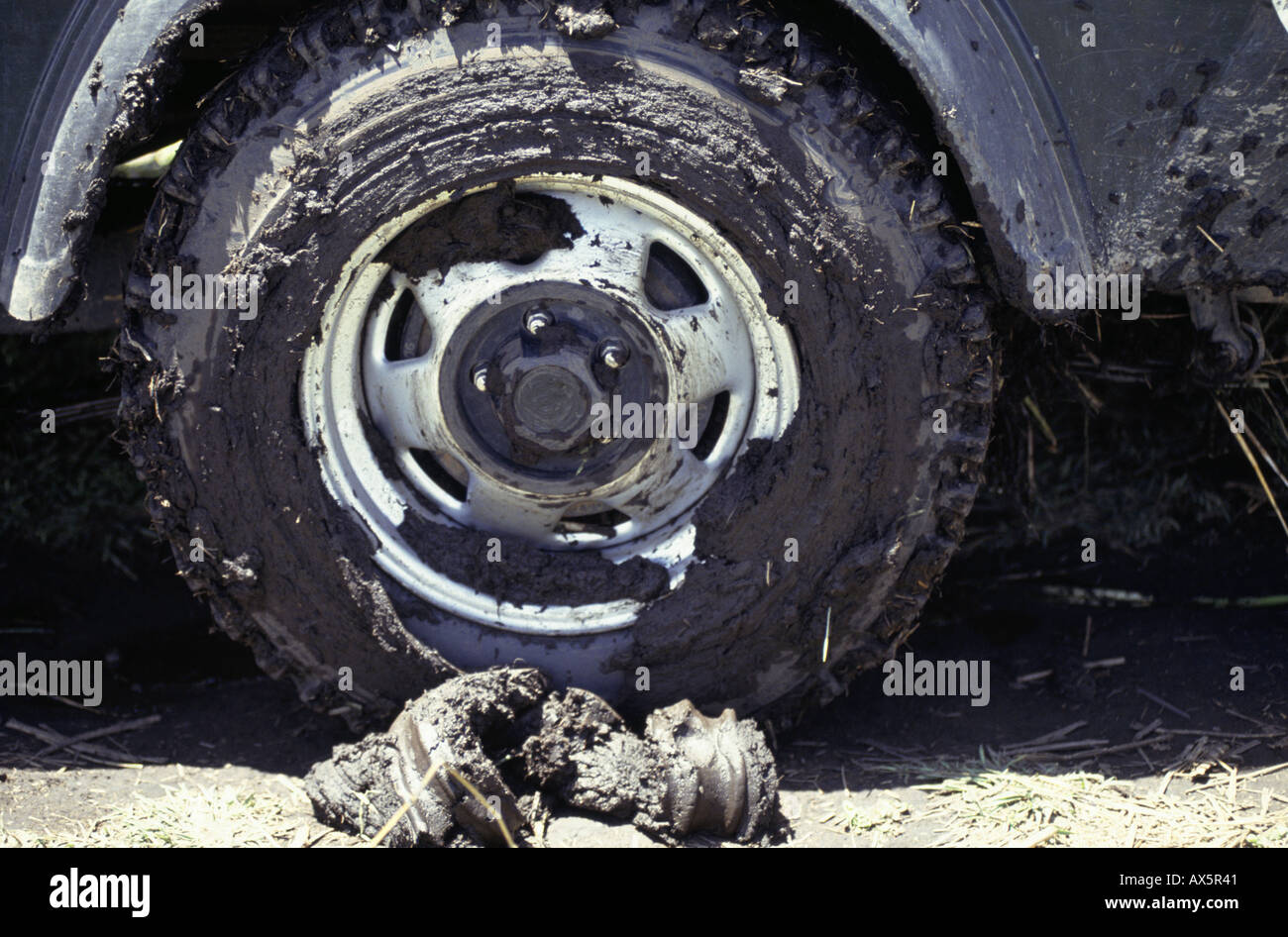 Chipundu, Zambia. Mud-coated wheel of a four wheel drive Jeep. Stock Photo