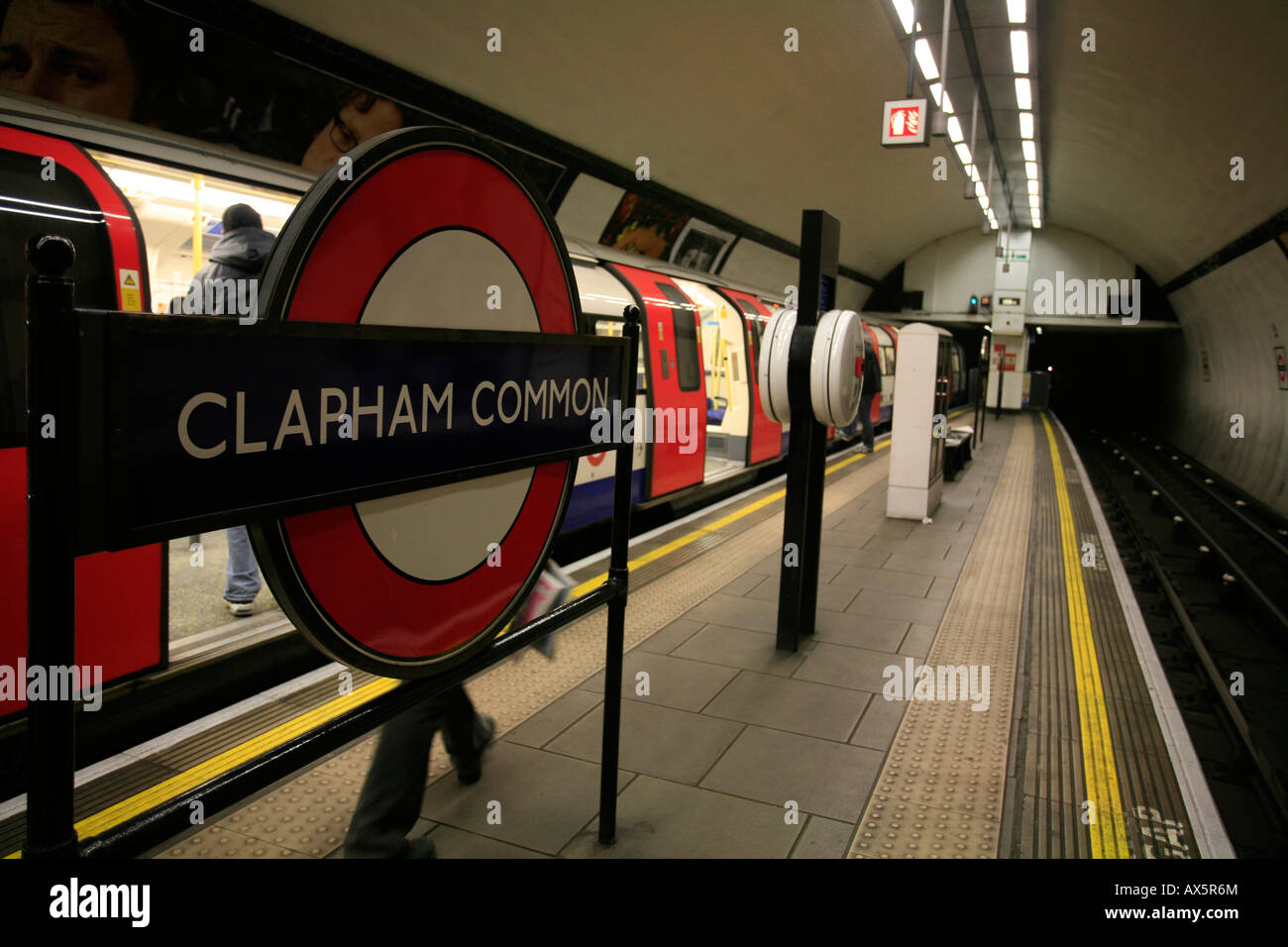 Passengers and train arriving at Clapham Common underground station, London, England, UK, Europe Stock Photo