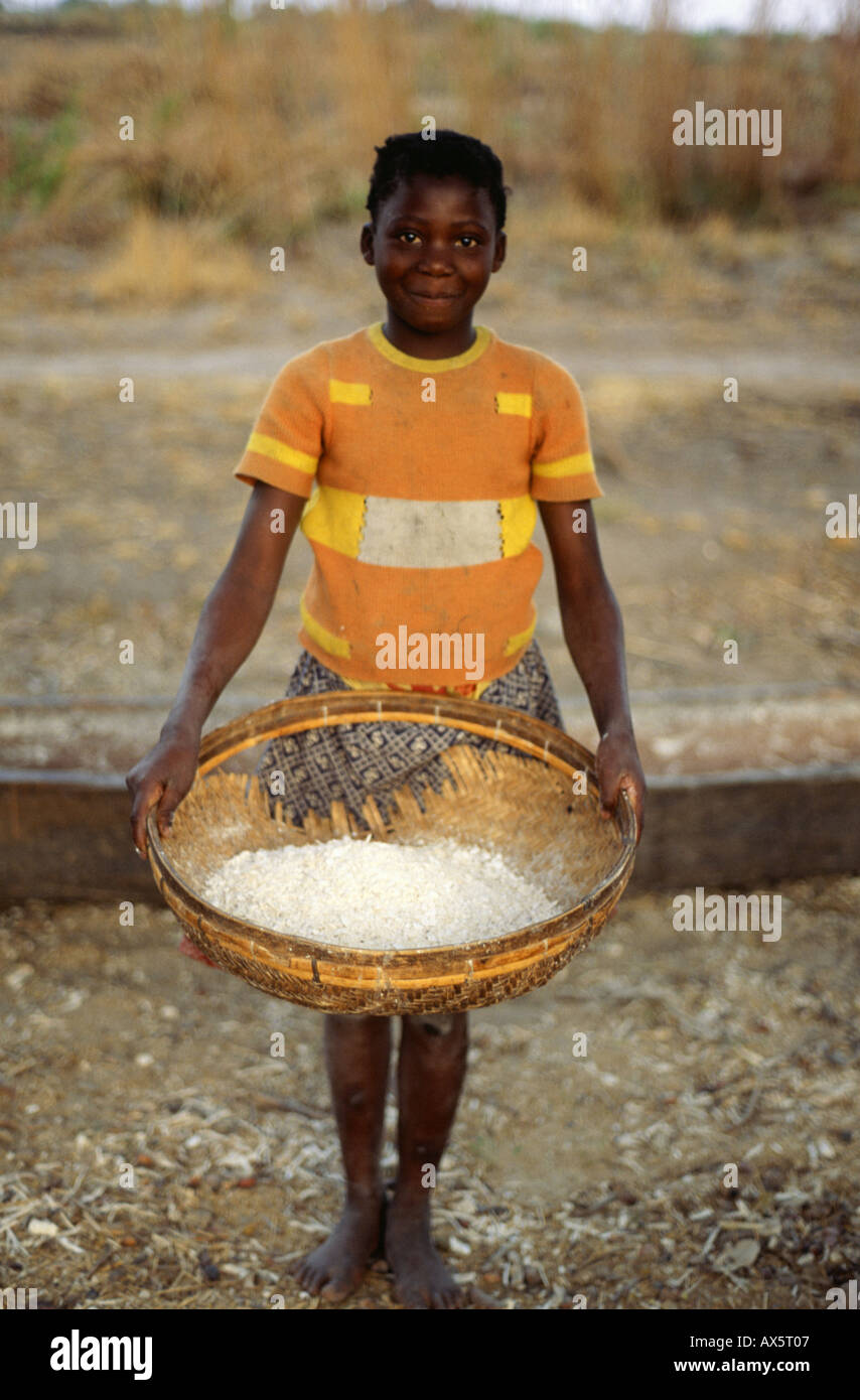 Mbati, Zambia. Girl with a basket of cassava flour Stock Photo Alamy