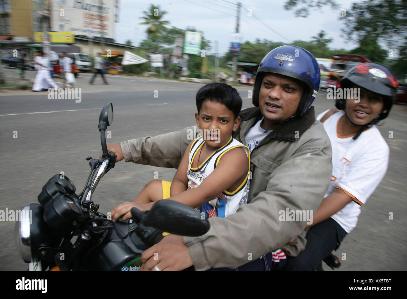 Family piled onto a motorbike in Godagama, Sri Lanka, South Asia Stock Photo