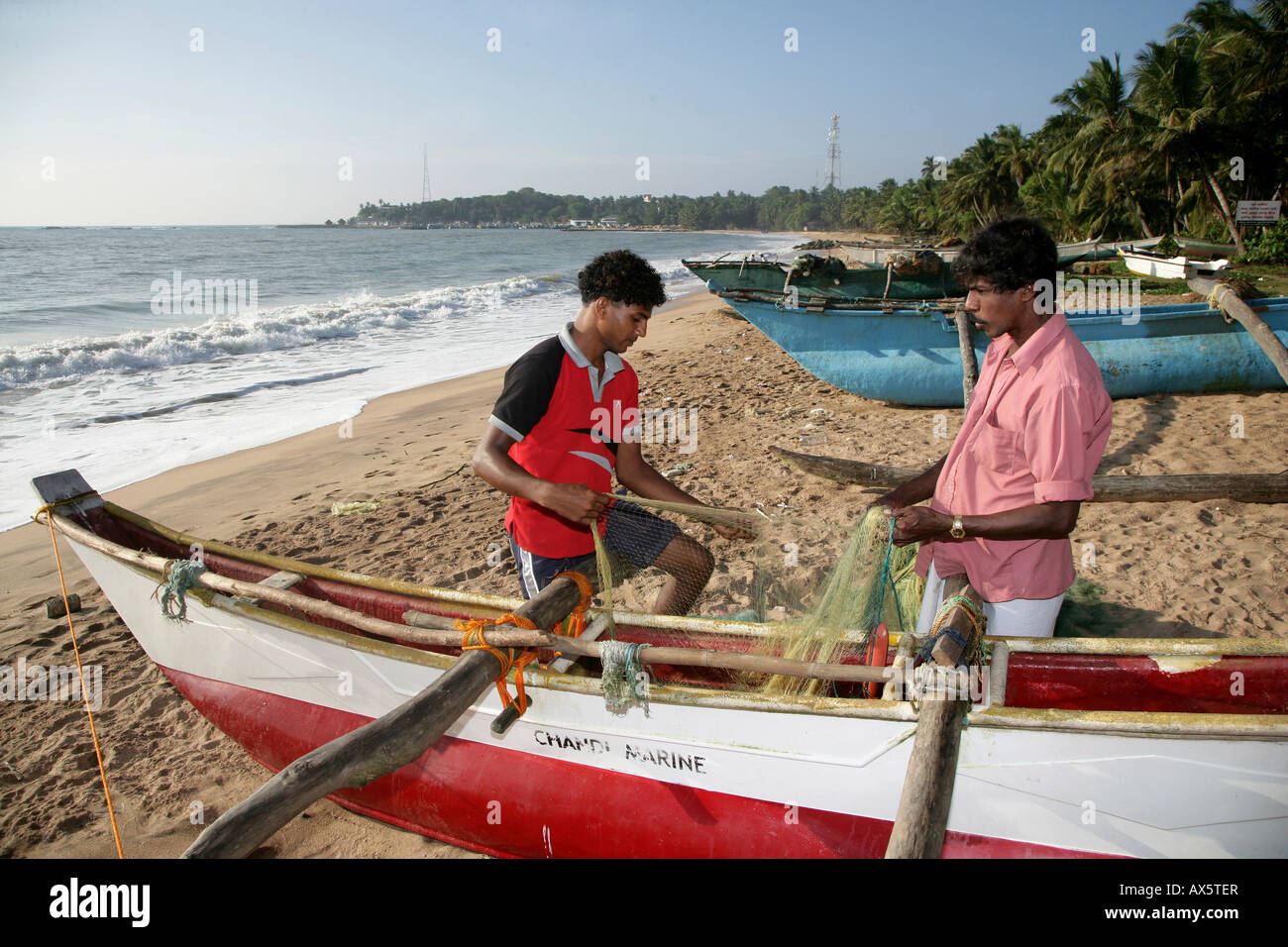Fishing boat on the beach, Tangalle, Sri Lanka, Asia Stock Photo
