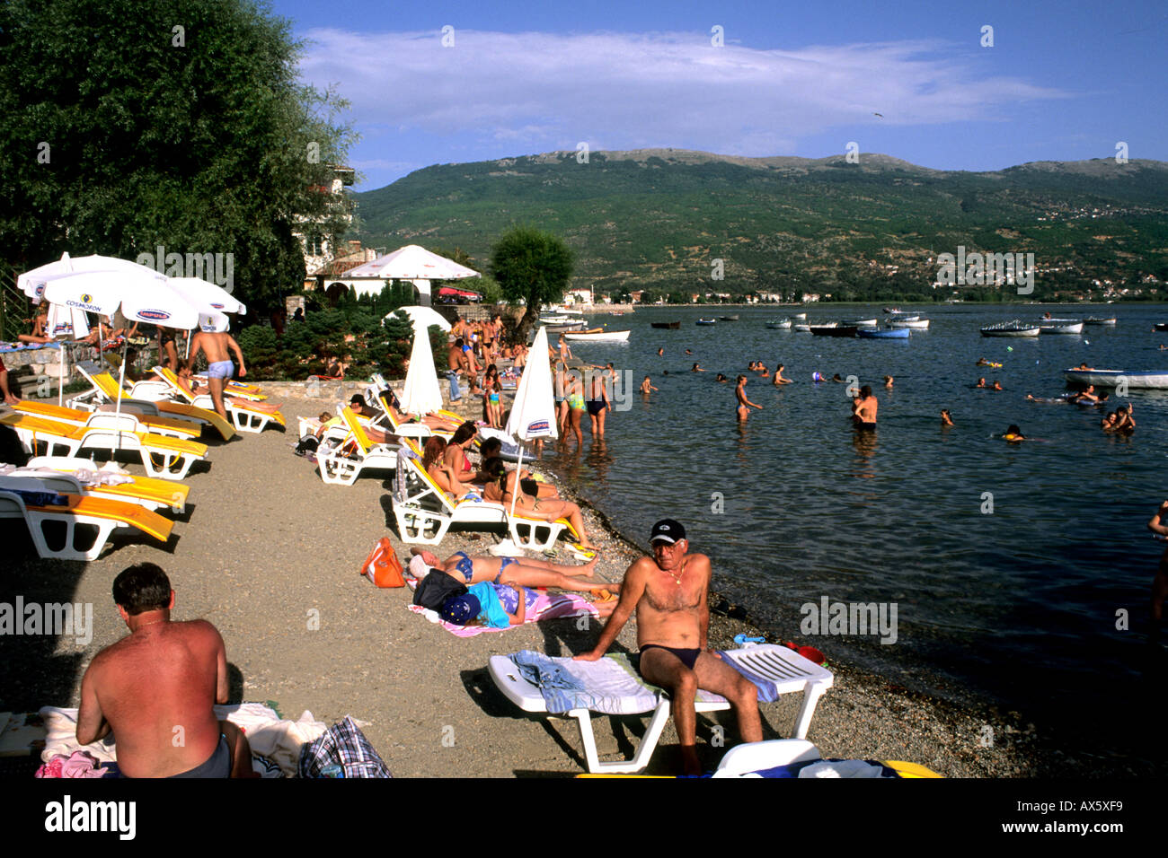 Beaches of holiday sunbathers on Lake Ohrid in Holiday town of ...