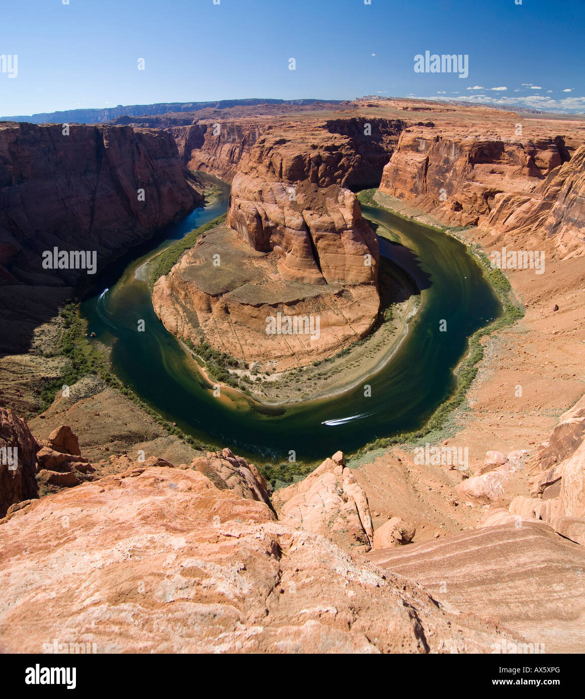 Two boats navigating the Horseshoe Bend river bend, Colorado River, Gooseneck near Page, Arizona, USA, North America Stock Photo