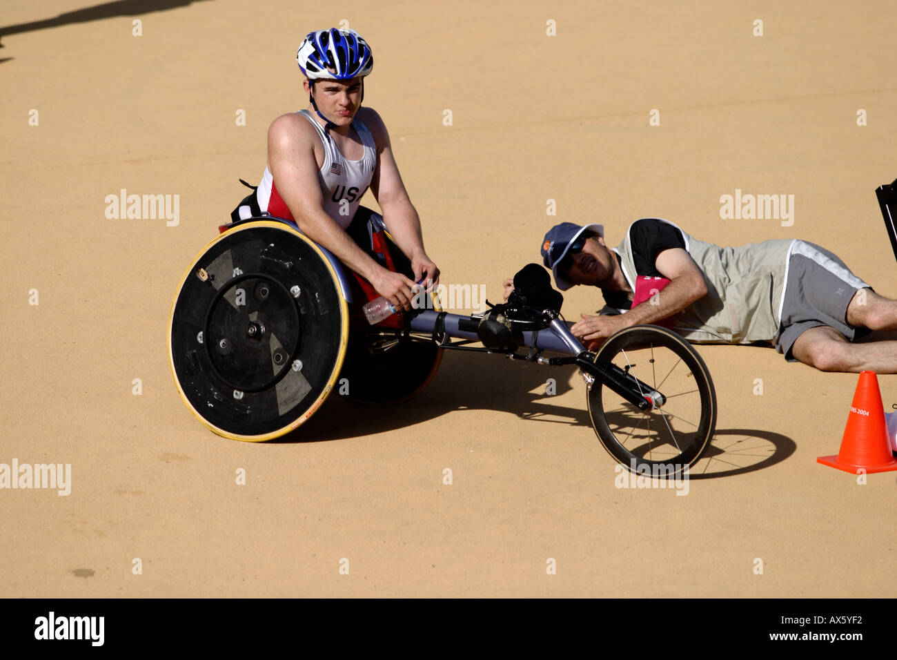 Photographer photographs an unknown American male wheelchair athlete after the mens T54 category marathon Stock Photo