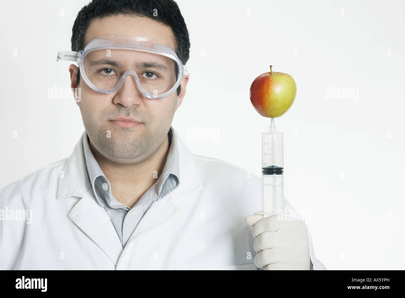 Humorous representation of a chemist producing genetically modified food Stock Photo