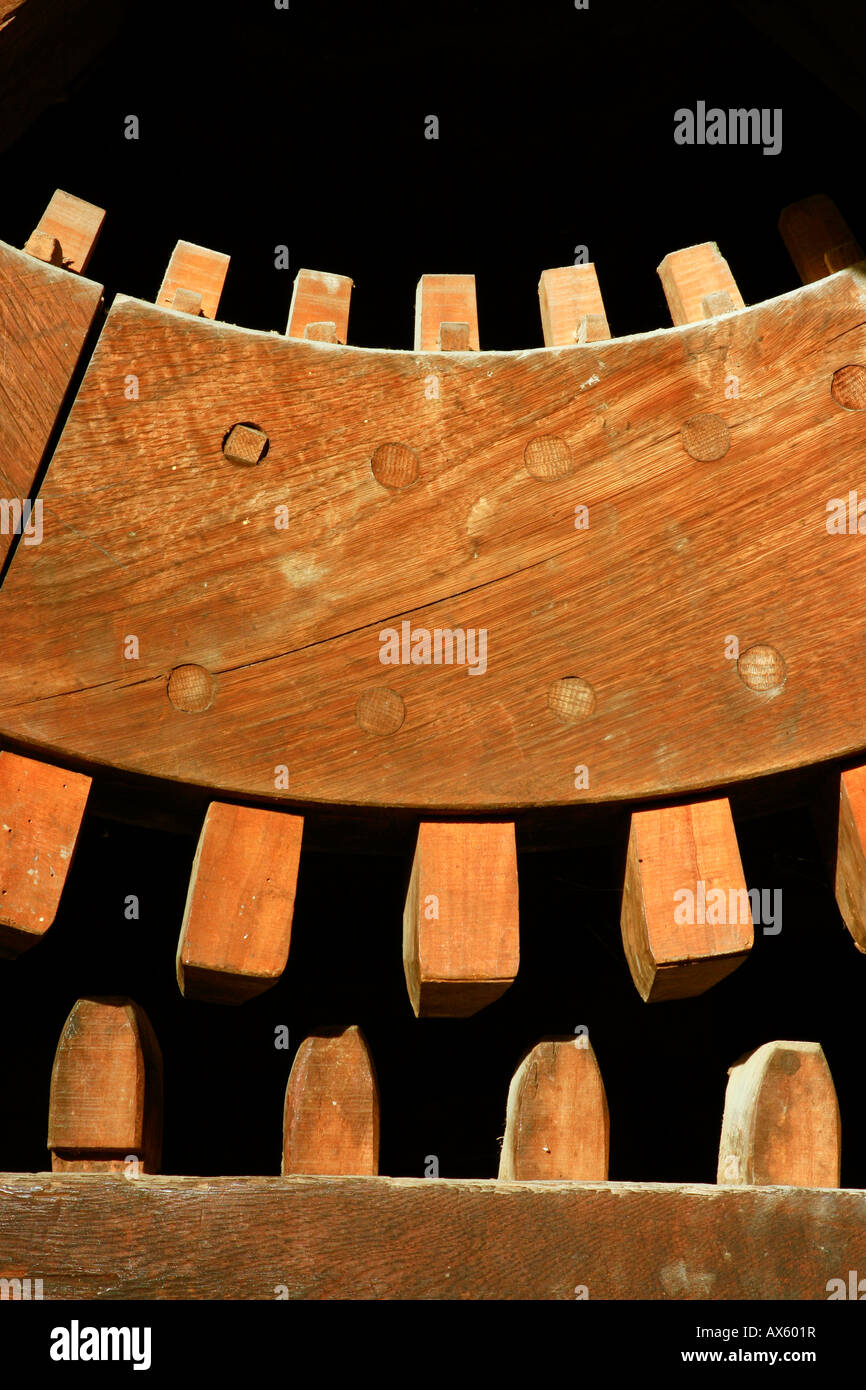 Gears on a wooden cogwheel in an old mill Stock Photo