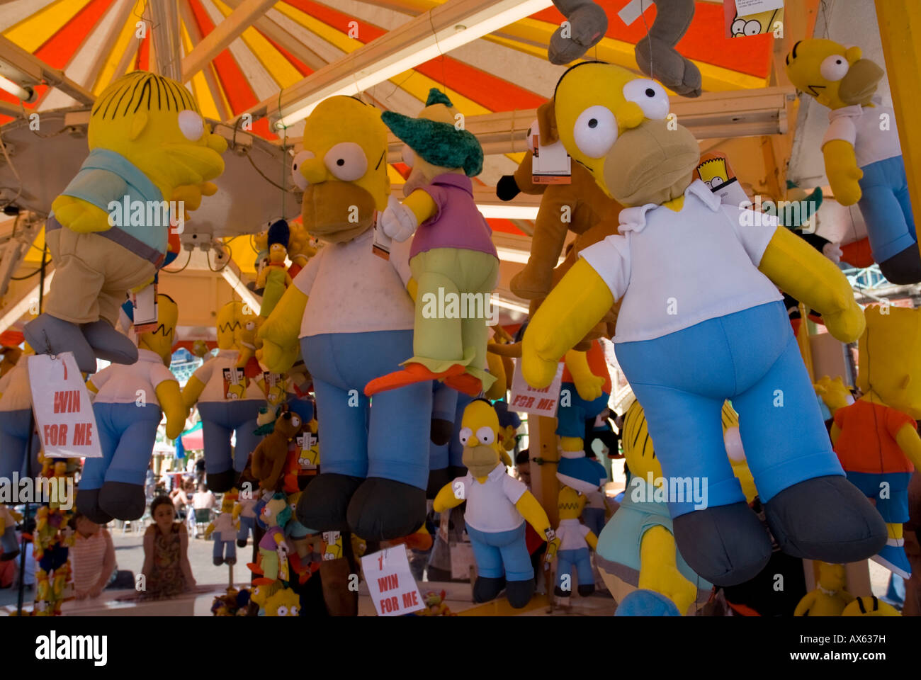 Homer Simpson Dolls at a Brighton fun fair England uk Stock Photo