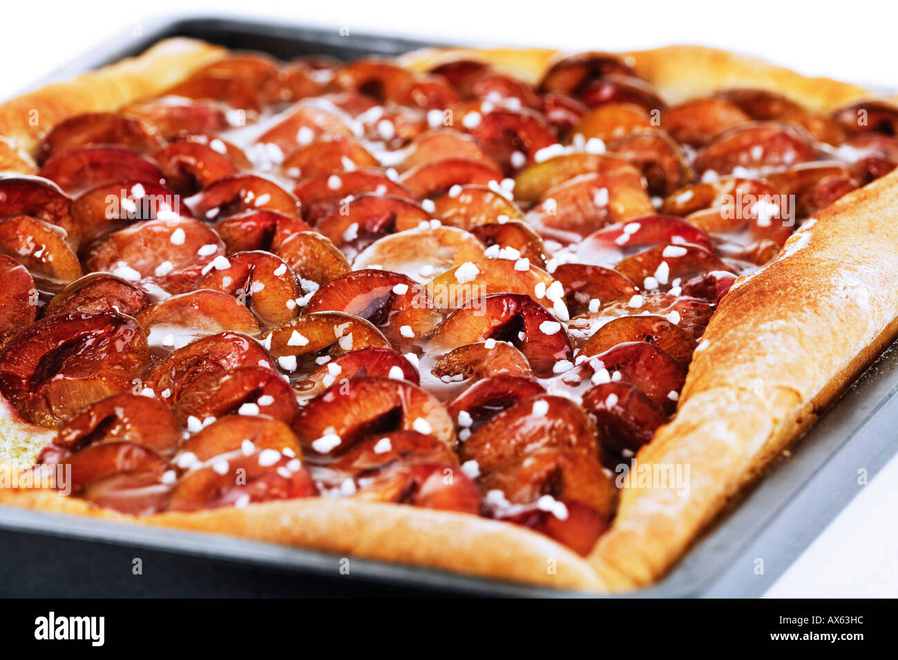 Plum cake on baking tray Stock Photo