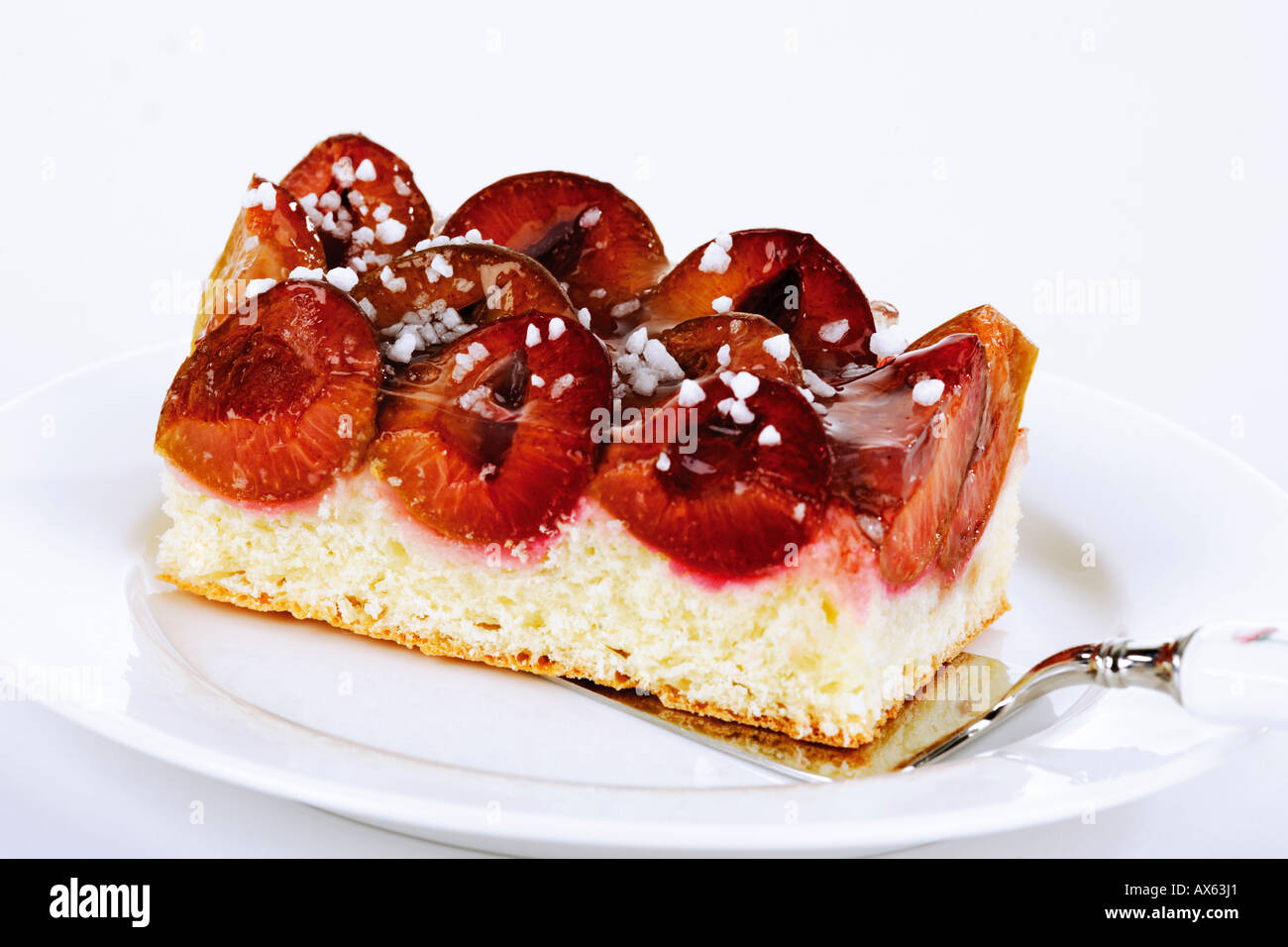 Plum cake on plate Stock Photo