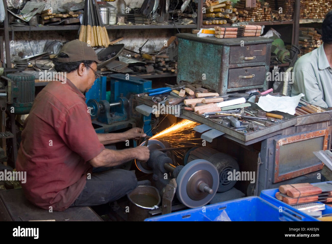 Grinding and sharpening knives scissors chisels and other tools in