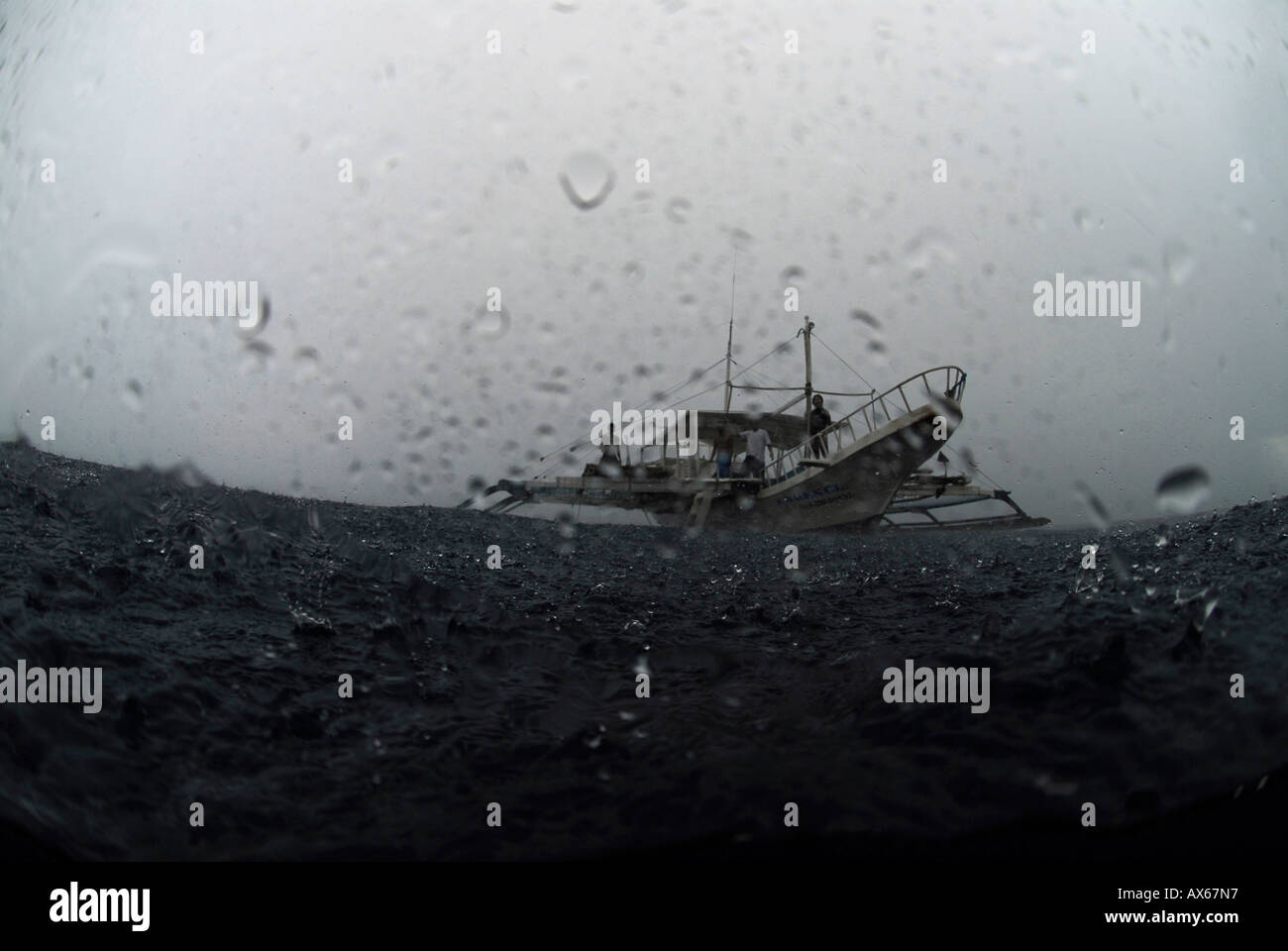 Philippines, boat in rain Stock Photo Alamy