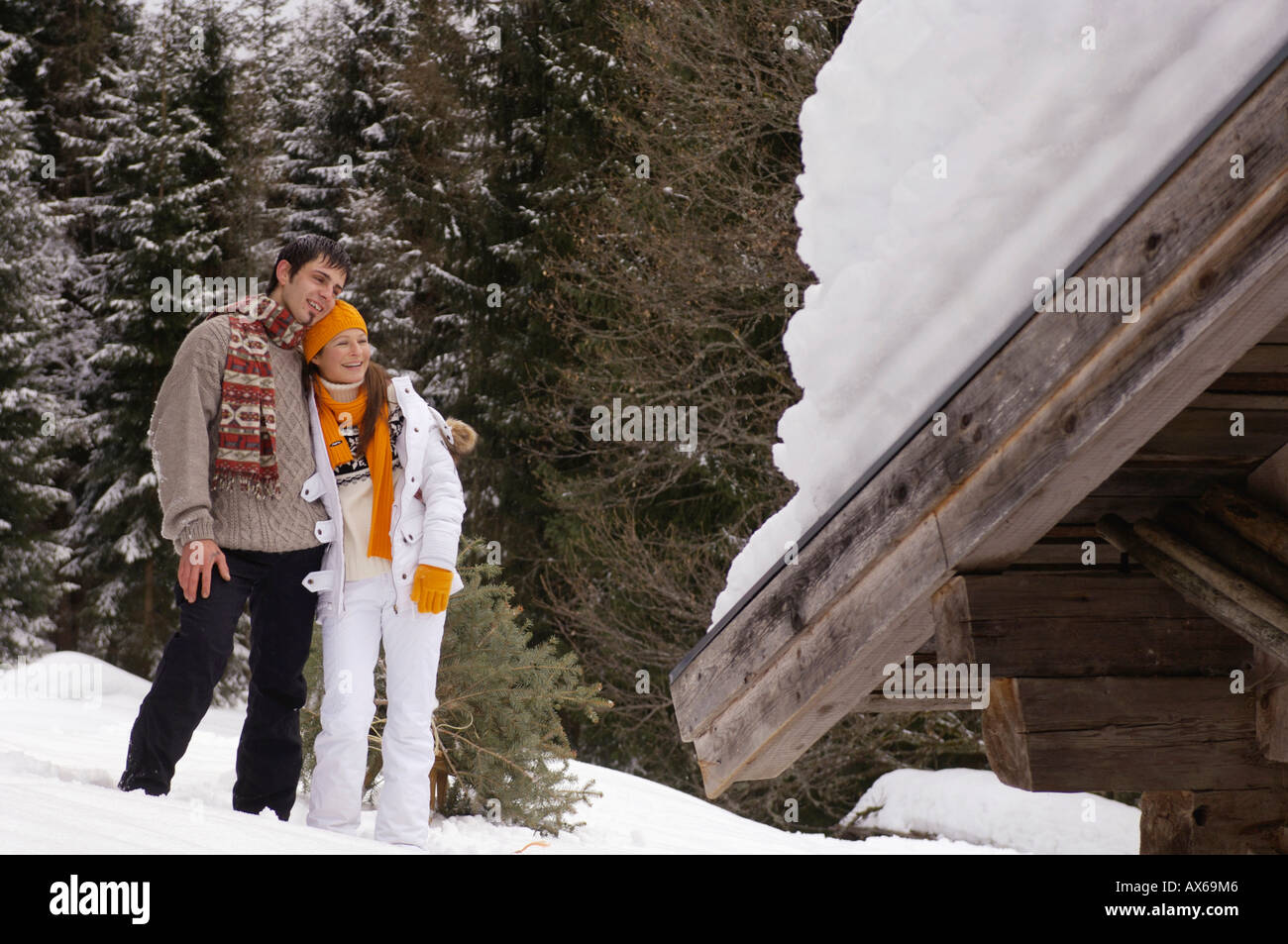 Couple in snow, smiling Stock Photo