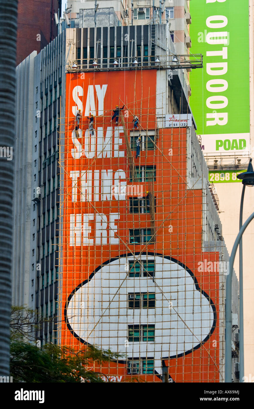 Bamboo Scaffolding Billboard Advertising on the Wall of a Building in Hong Kong Stock Photo