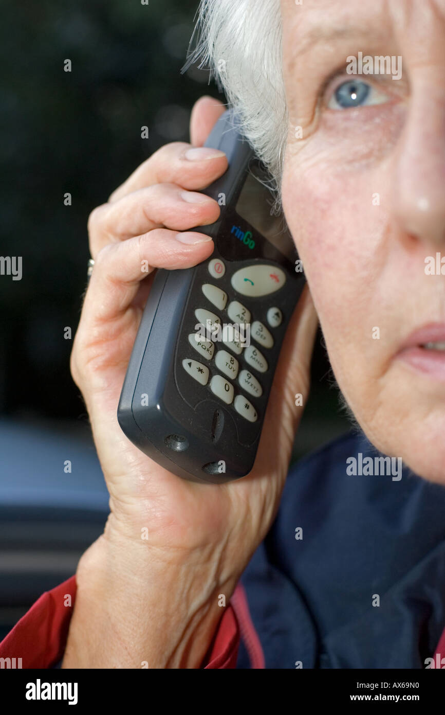 Close up of woman speaking on old Nokia mobile phone UK Stock Photo