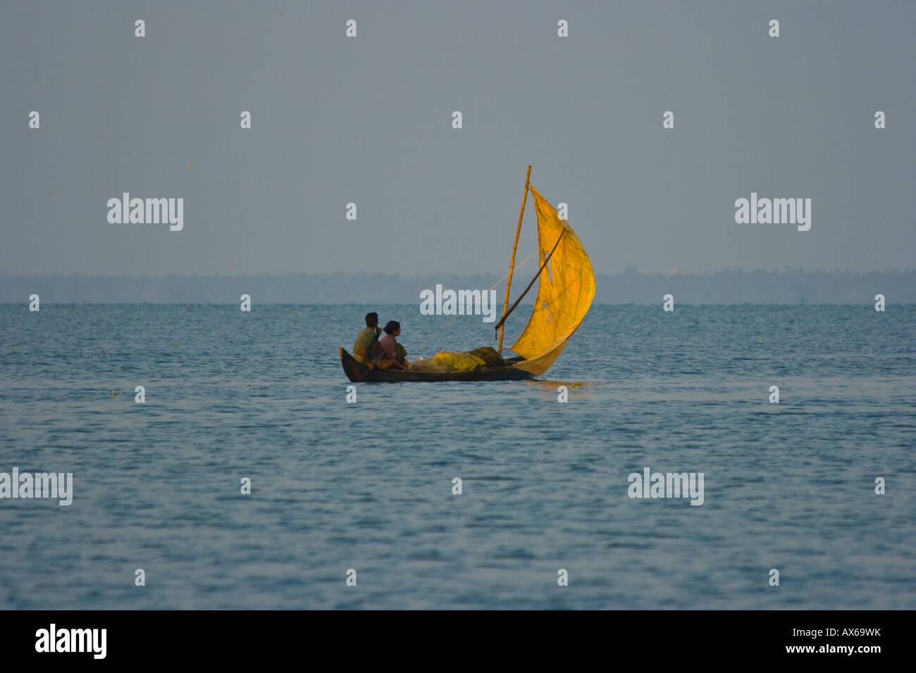 Small Sailboat in the Keralan Backwaters in India Stock Photo
