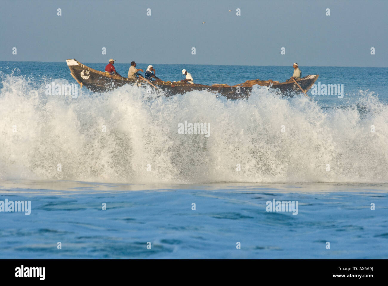 Fishermen In A Fishing Boat Heading Out To Drop Nets Before Pulling