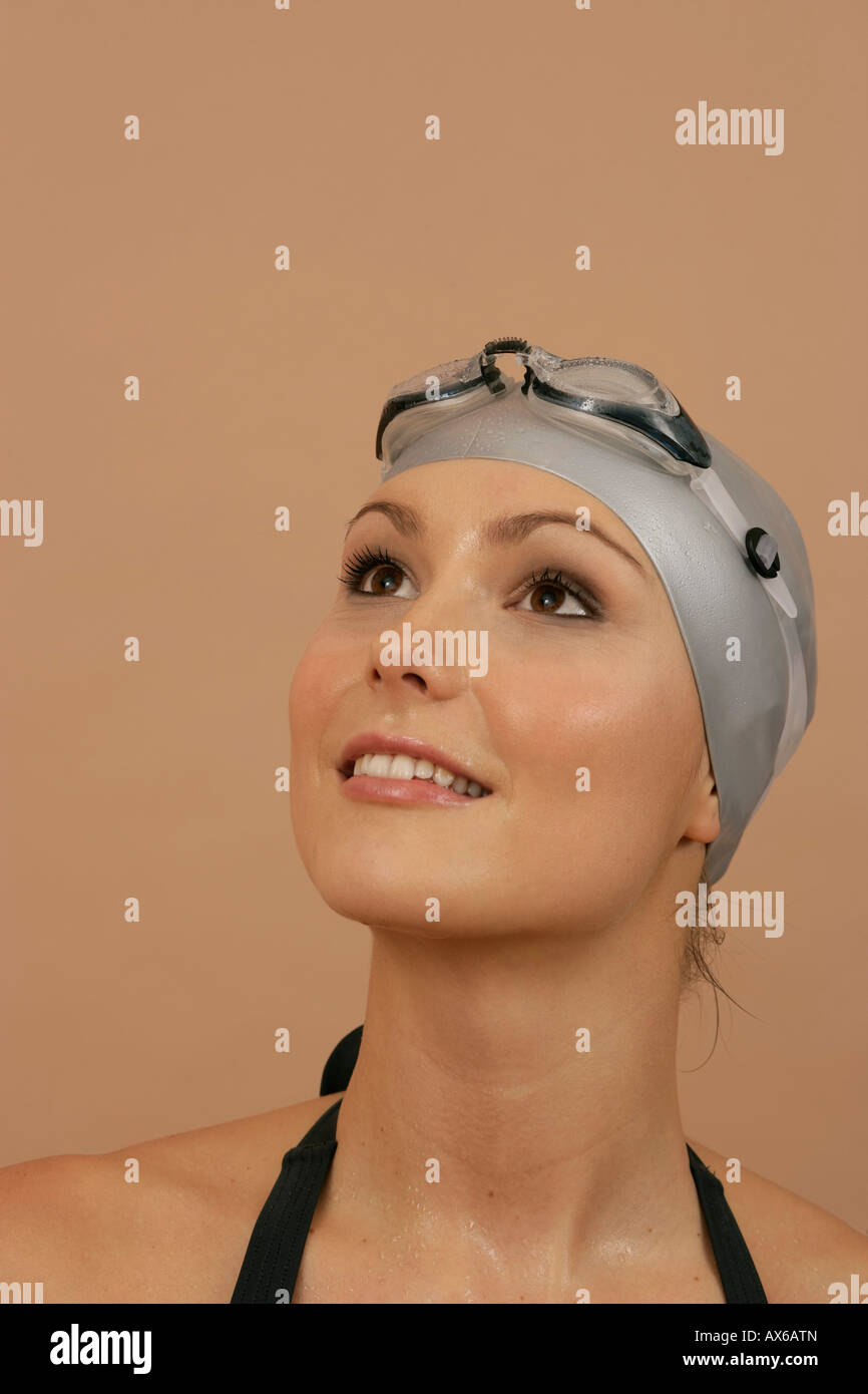 A female swimmer wearing a bathing cap and goggles Stock Photo Alamy