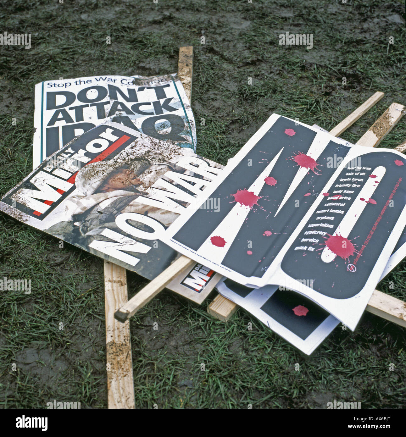 No War signs lying in the mud at Hyde Park after the Anti Iraq War march anti-war Rally in London15 February 2003  KATHY DEWITT Stock Photo