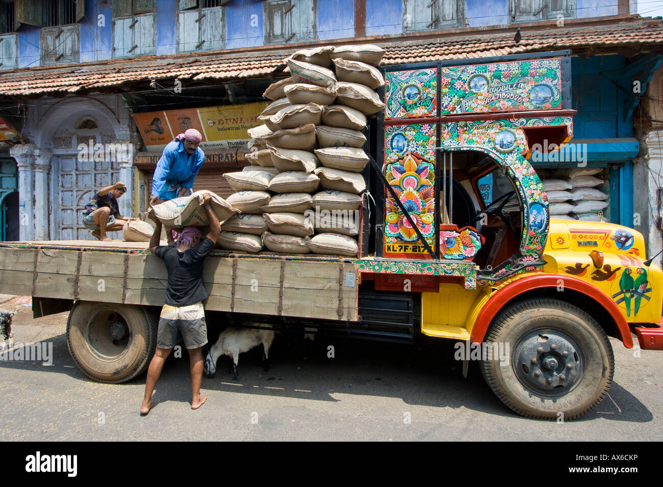 Workers Unload and Carry Sacks in Mattancherry in Cochin South India Stock Photo