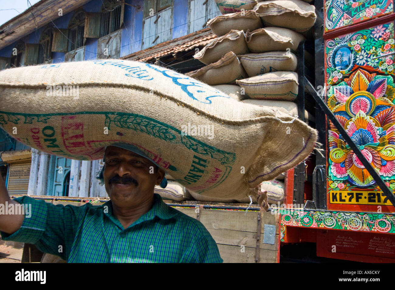 Workers Unload and Carry Sacks in Mattancherry in Cochin South India Stock Photo