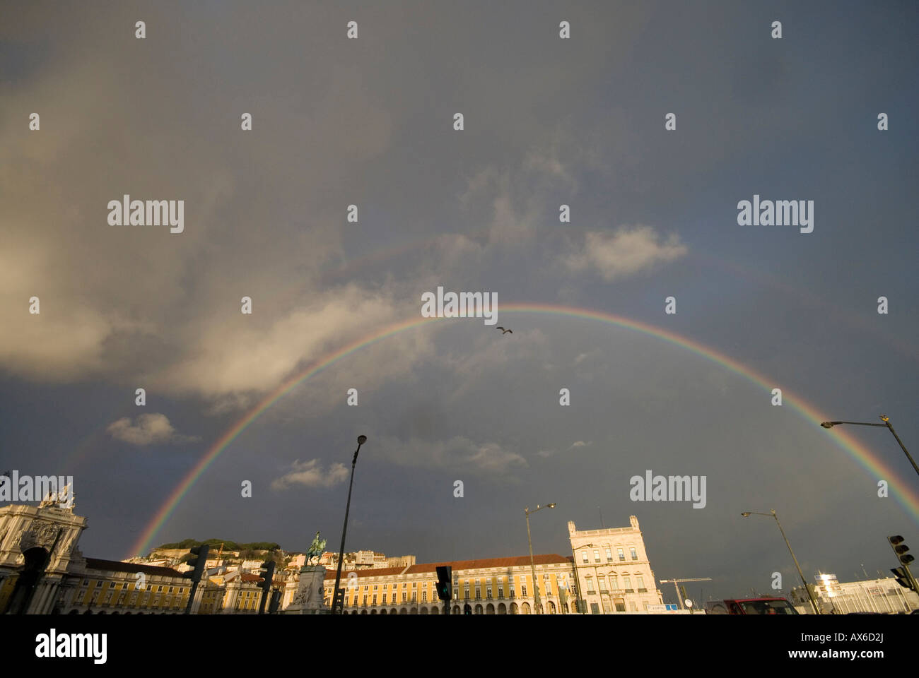 Rainbow over commerce square in Lisbon Stock Photo