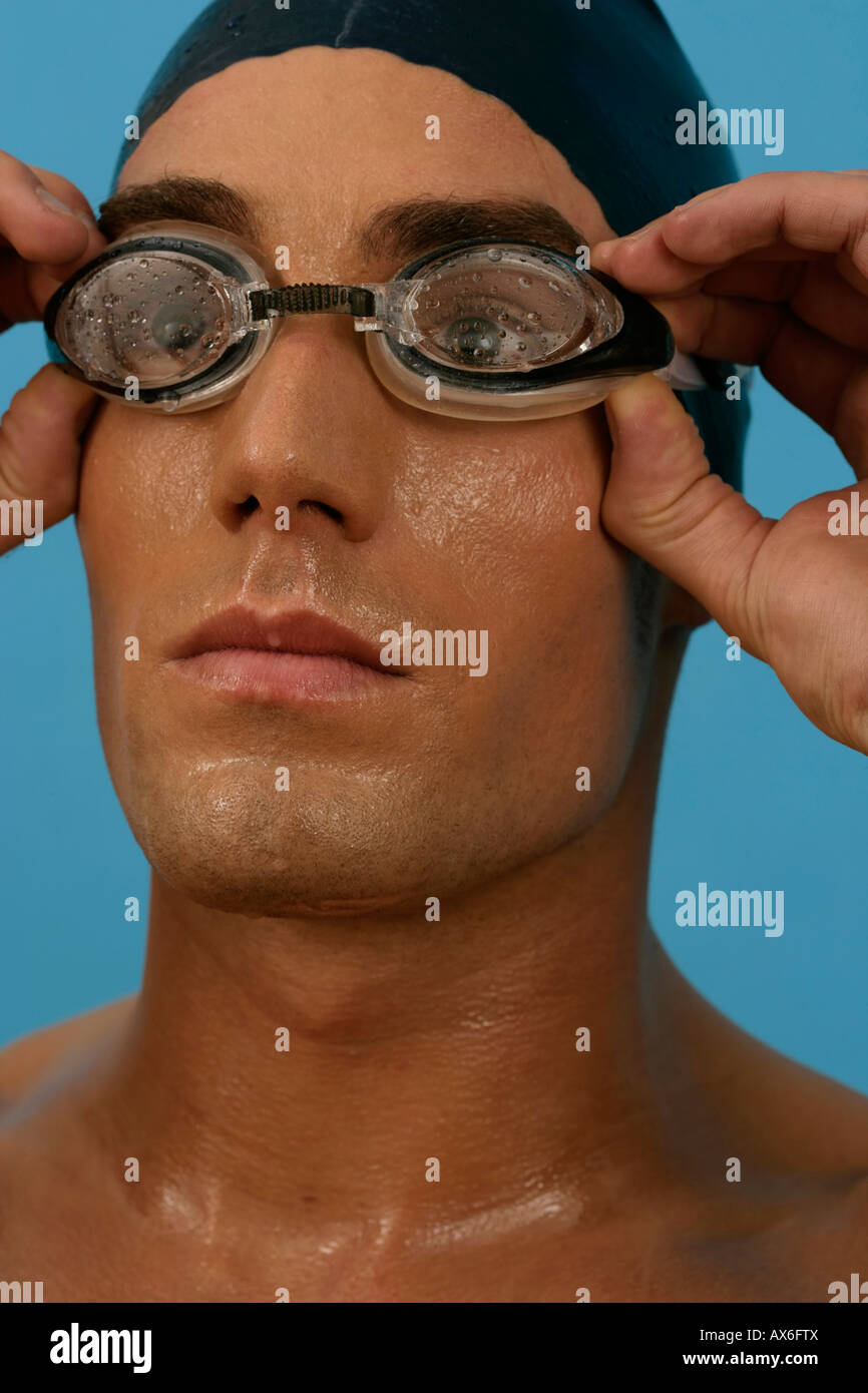 Portrait of a swimmer wearing a bathing cap and goggles Stock Photo Alamy