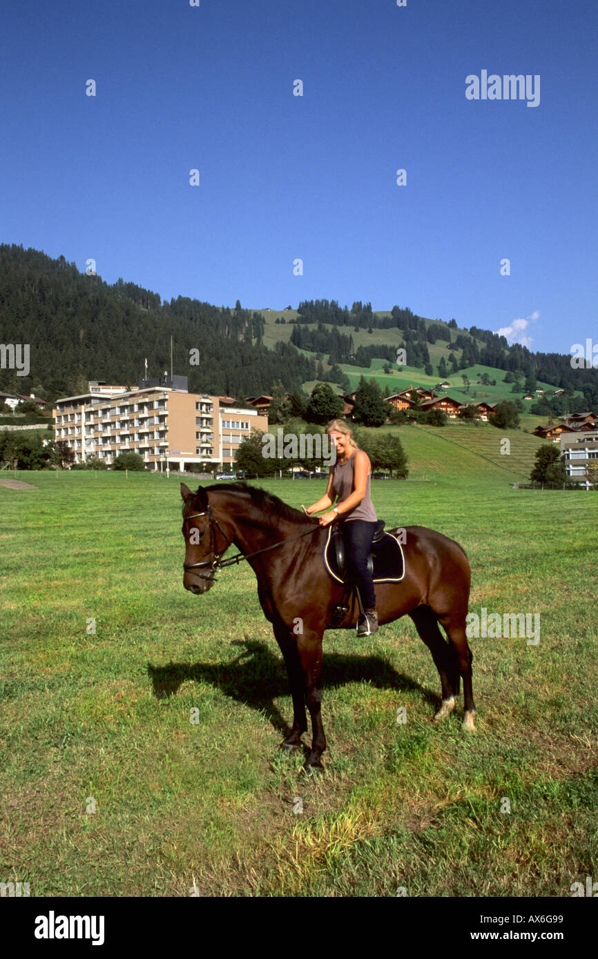 Switzerland the Good Expensive Life with native woman riding horse near